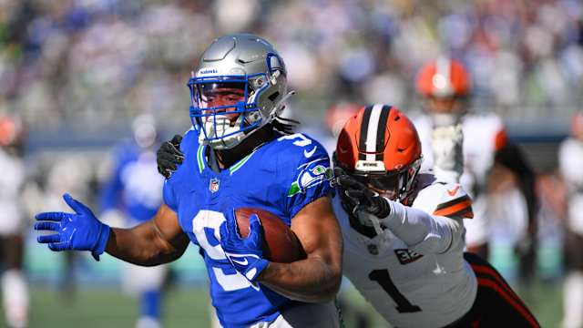 Seattle Seahawks running back Kenneth Walker III (9) carries the ball while Cleveland Browns safety Juan Thornhill (1) chases during the first half at Lumen Field.